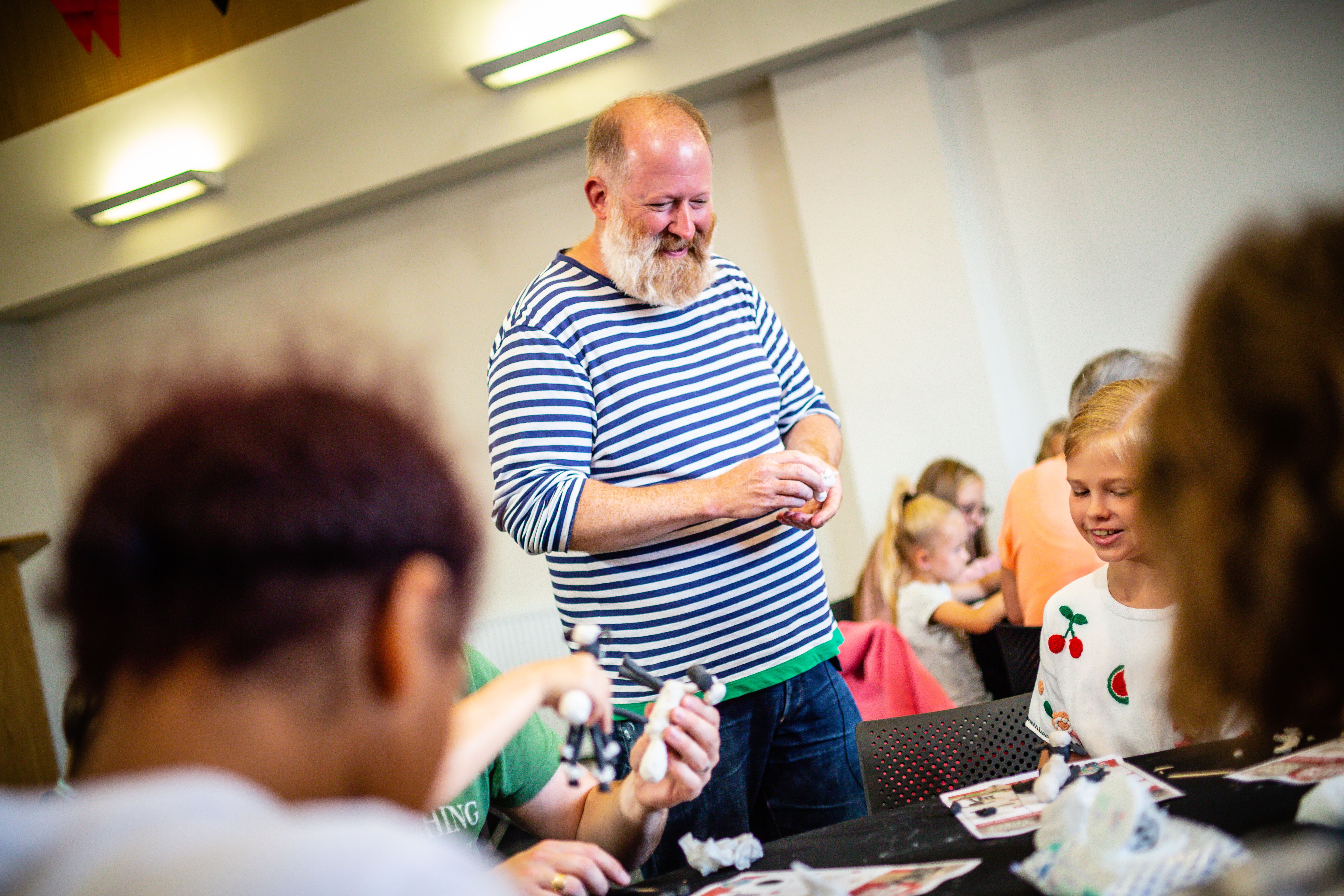 Jim Parkyn from Aardman Model-Making Workshop showing children how to make models of sheep, during a Children's Book Festival event.