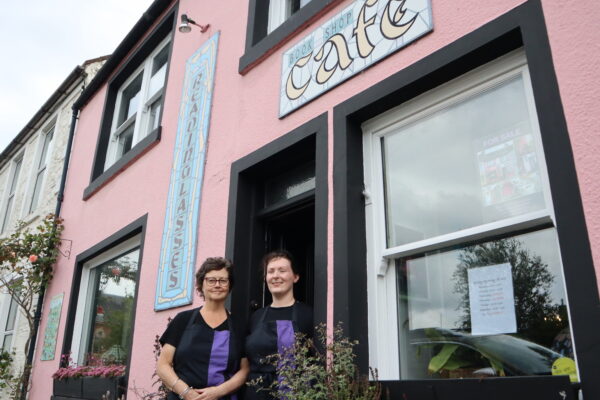 Jacqui owner of Reading Lasses and staff member outside ReadingLasses pink bookshop