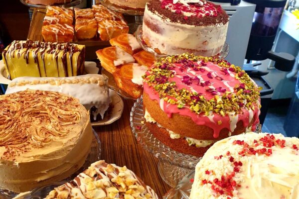 Selection of ReadingLasses brightly decorated large round cakes and loaf cakes