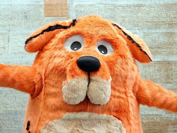 The Big Dog mascot, a large and fluffy orange dog, from the children's book festival taking place in Dumfries.