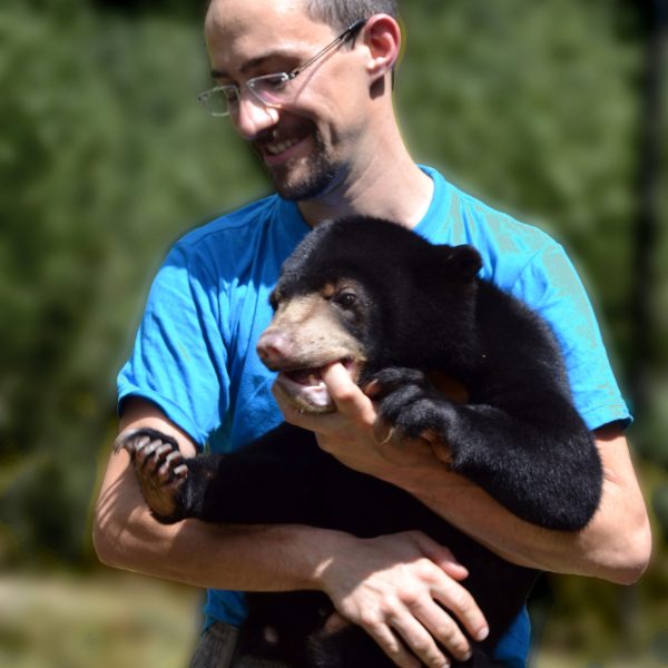 Romain and sun bear cub in Cambodia 1