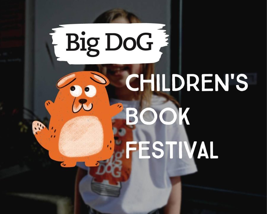 Big Dog Children's Book Festival mascot with a child.